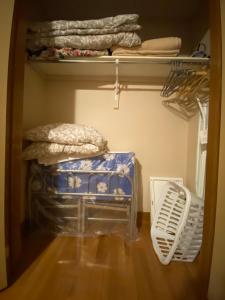 a walk in closet with a stack of beds at Anna's Bed & Breakfast in Niagara Falls