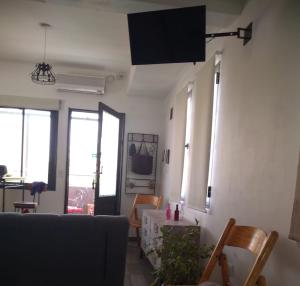 a living room with a couch and a table at OLASCOAGA DOS monoambiente in Mendoza