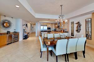 a dining room and kitchen with a table and chairs at Turquoise Place #2205C in Orange Beach