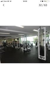 a gym with chairs and machines in a building at APARTAMENTO PORTO REAL RESORT VISTA ESPETACULAR in Mangaratiba