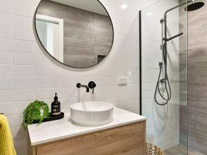 a bathroom with a sink and a mirror at Lansell Retreat in Cowes +13 photos