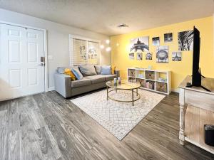 a living room with a couch and a table at HOMEY PARIS - NEW / Free garage parking / Downtown Salt Lake City in Salt Lake City