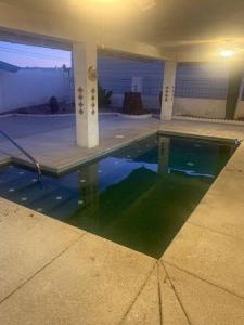 a swimming pool in the middle of a house at Lake Havasu Retreat w pool Everything Nearby! in Lake Havasu City