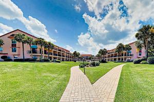 a brick walkway in front of a large building at Sea Fair Condo Unit 12128 in Saint Augustine