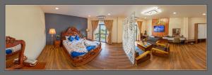 a large room with a bed and a living room at khách Sạn Yên Châu in Chau Doc