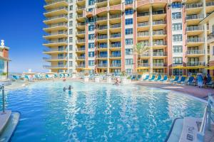 a swimming pool in front of a hotel at Emerald Grande in Destin