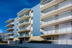 an apartment building with balconies on the side of it at Blue Sea Colony 501 in Ocean City