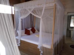 Кровать или кровати в номере Coconut Island Yala