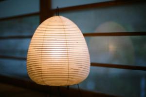 a white lamp sitting on top of a table at Hakonowa in Hakone