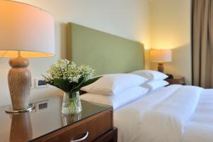 Posteľ alebo postele v izbe v ubytovaní Regent Warsaw Hotel