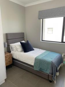 Flat 14 Block 6 Bellamare客房内的一张或多张床位