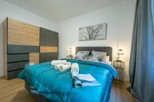 Postel nebo postele na pokoji v ubytování Boutique Apartments