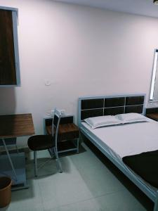 Postel nebo postele na pokoji v ubytování Anand P G hostel males only