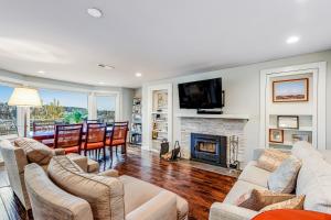 a living room with a fireplace and a tv at Top of Queen Anne in Seattle