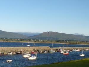 a group of boats docked in a body of water at The Beach Hotel in Mullaghmore