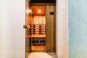 a door to a wine cellar with wine bottles at Koncha-Zaspa Spa Hotel in Svalyava