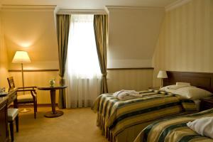 Letto o letti in una camera di Hotel Stefanik
