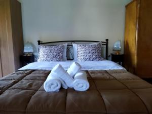 A bed or beds in a room at Agroikia