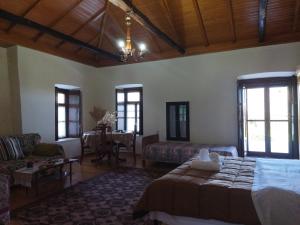 A bed or beds in a room at Agroikia