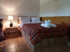 A bed or beds in a room at Agroikia