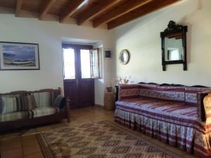 A bed or beds in a room at Agroikia