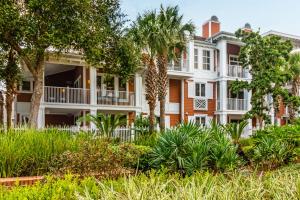 a large house with trees and plants at Beauty by the Bay in Destin