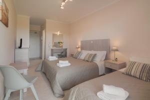 Un pat sau paturi într-o cameră la Hotel Varres