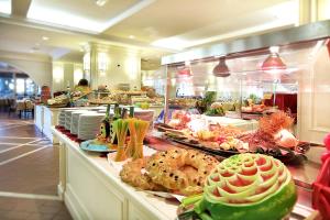 a buffet line with many different types of food at iGV Club Marispica in Ispica
