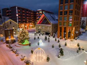 a large christmas tree in the middle of a city at Metropol Spa Hotel in Tallinn