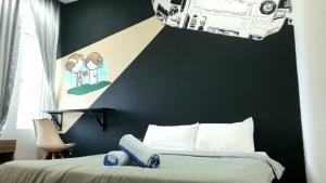 a bedroom with a black accent wall and a bed at Starwarzz Medini 1 Legoland in Nusajaya +27 photos