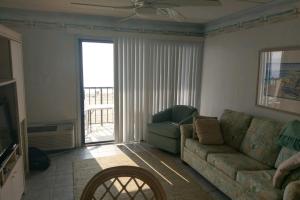 a living room with a couch and a chair at Decatur House in Ocean City