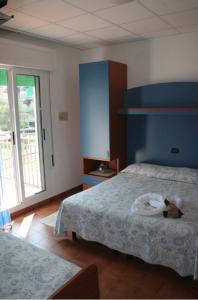 Postel nebo postele na pokoji v ubytování Hotel Trifoglio