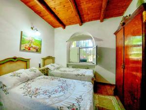 a bedroom with two beds and a window at La Torretta di Francavilla al Mare in Francavilla al Mare +80 photos