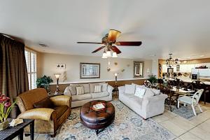 a living room filled with furniture and a ceiling fan at Mainsail IV in Destin