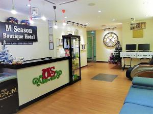 a store with a store with a christmas tree in a room at M Season Boutique Hotel Sdn Bhd in Sungai Petani