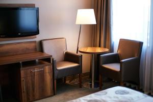 Televízia a/alebo spoločenská miestnosť v ubytovaní Holiday Inn Krakow City Centre by IHG