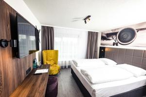Postel nebo postele na pokoji v ubytování Sombea Donaueschingen