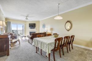 a living room with a table and a couch at Mariners Watch 205 in Ocean City +18 photos