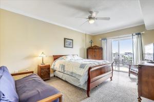 a bedroom with a bed and a window at Mariners Watch 205 in Ocean City