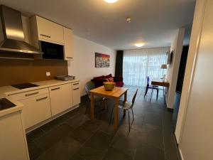 Kuchyň nebo kuchyňský kout v ubytování smartroom Rössli Hunzenschwil