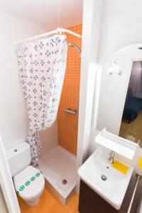 a bathroom with a shower and a toilet and a sink at Gran Duc Pedrous in Pas de la Casa +14 photos