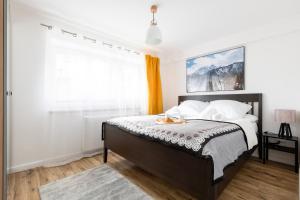 Posteľ alebo postele v izbe v ubytovaní Dom Pod Gubałówką - Zakopane Apartamenty