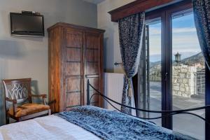 Posteľ alebo postele v izbe v ubytovaní Volhon Mansions of Parnassos