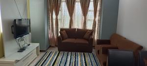 Μια τηλεόραση ή/και κέντρο ψυχαγωγίας στο Caliph Suite Apartment Homestay Anjung Vista Kubang Kerian