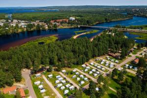 an aerial view of a park next to a river at First Camp Moraparken - Dalarna in Mora