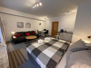 Postel nebo postele na pokoji v ubytování Apartmány U Pošty