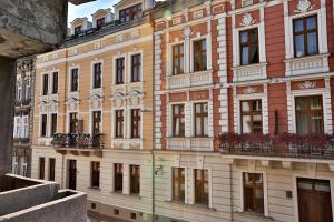 a large building with balconies on the side of it at Amber Boutique Hotels - Hotel Amber in Krakow