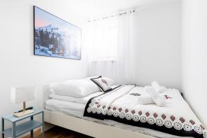 Posteľ alebo postele v izbe v ubytovaní Dom Pod Gubałówką - Zakopane Apartamenty