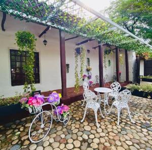 bicycles are parked in front of a house at Hotel Infinito La Casona in Villavieja