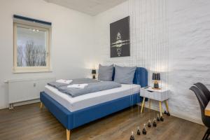 Säng eller sängar i ett rum på Arbio I Industrial Studio in Leipzig Bayerischer